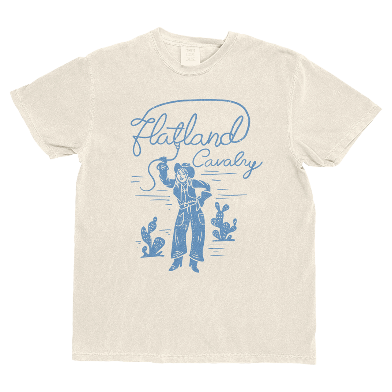 Beige t-shirt with blue graphic design of a cowboy and cacti on a white background