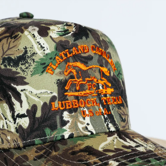 Camouflage baseball cap with orange embroidered logo reading ’flatland cavaliers, lubbock, texas u.s.a.’