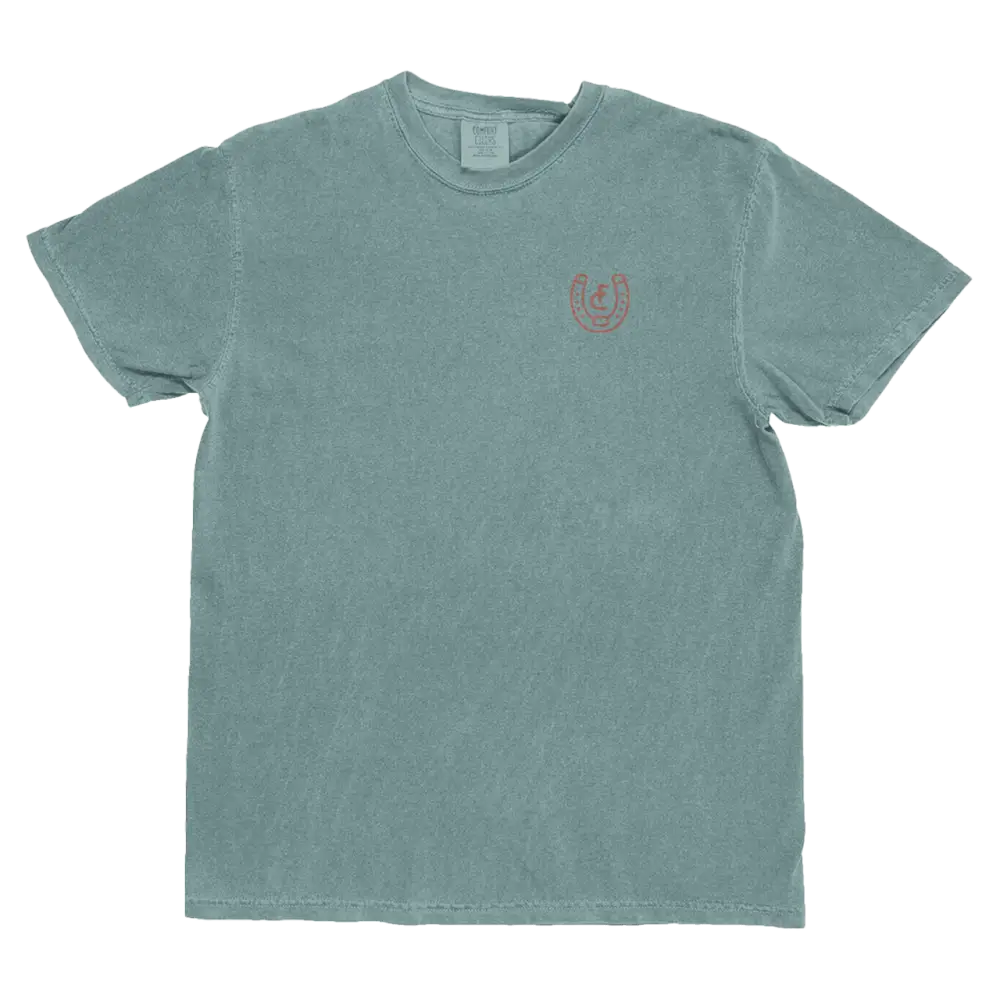 Sea-green t-shirt with a small horseshoe design.