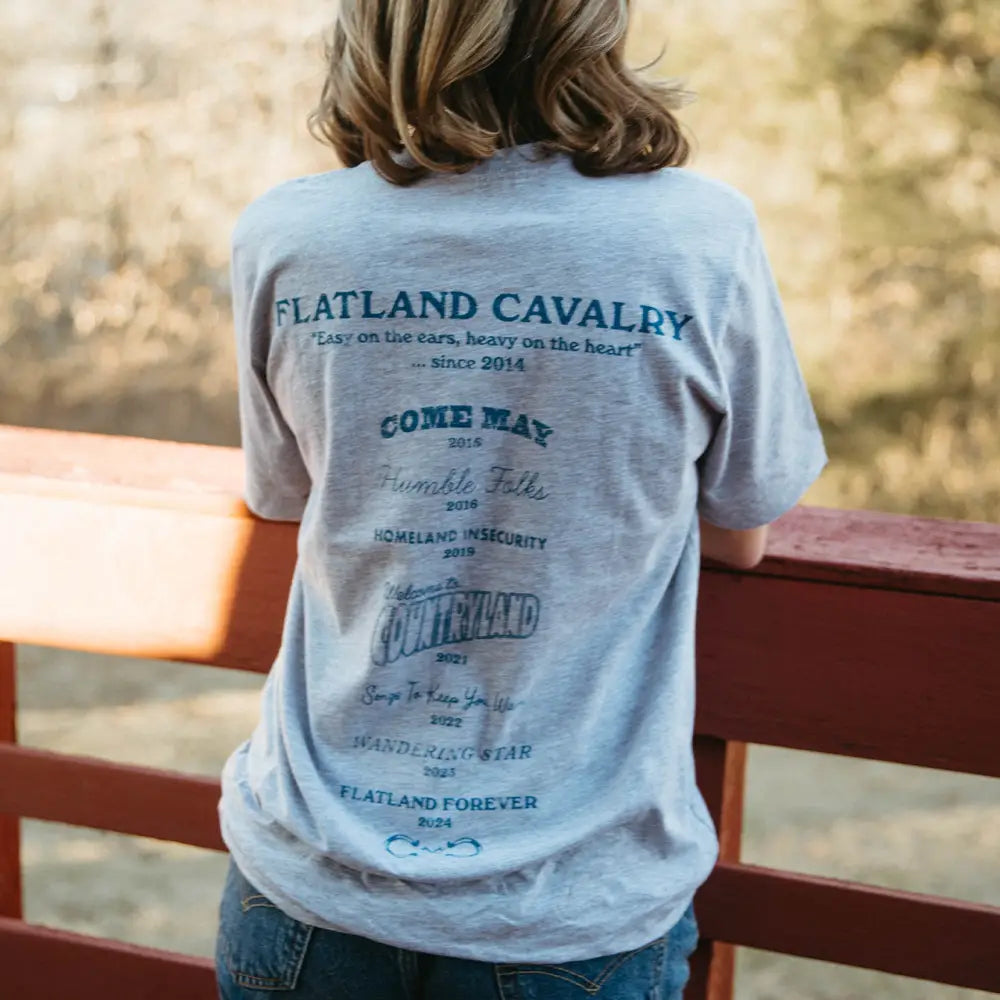 Gray t-shirt with band name and album titles.