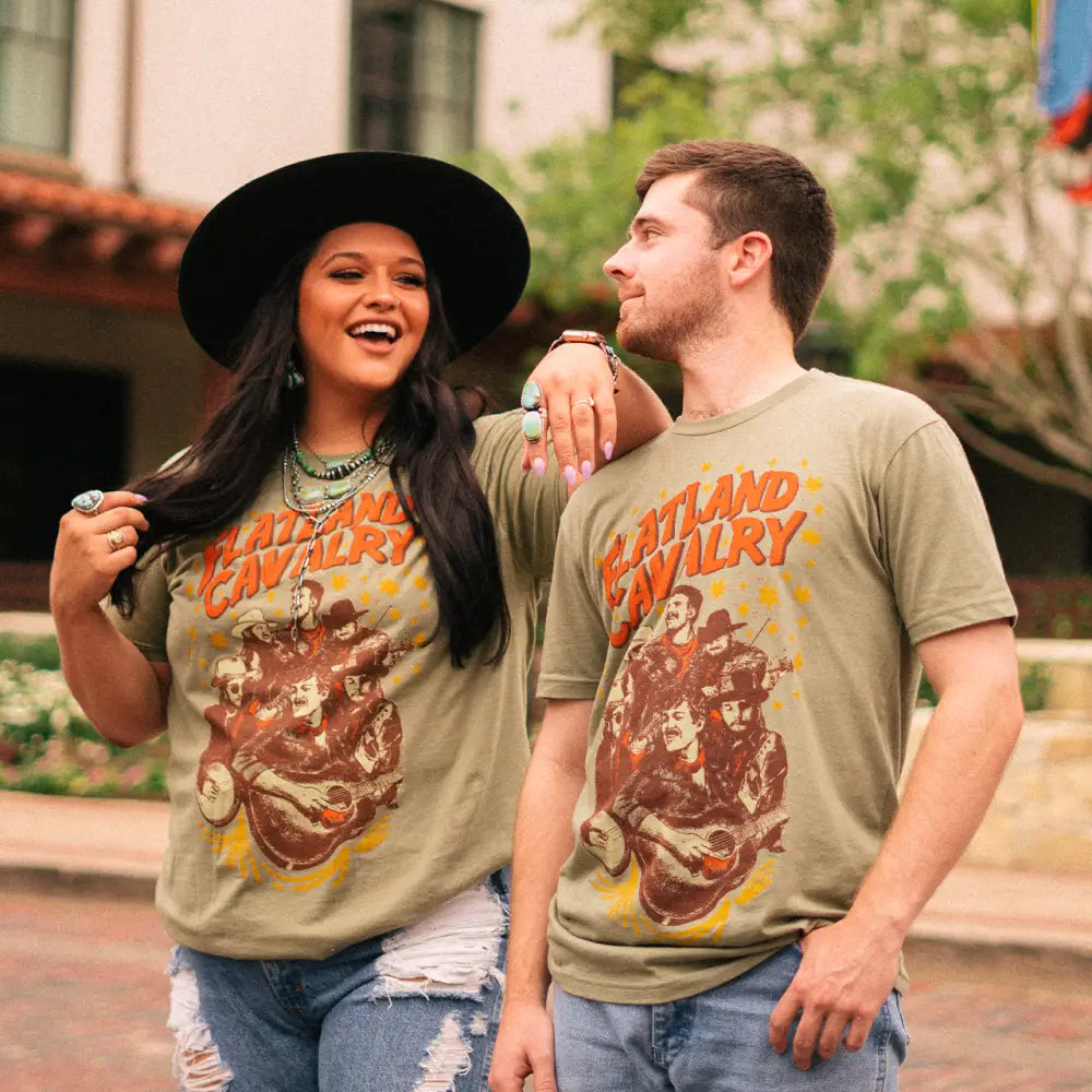 Two people wearing matching ’Cleveland Cavalry’ t-shirts.