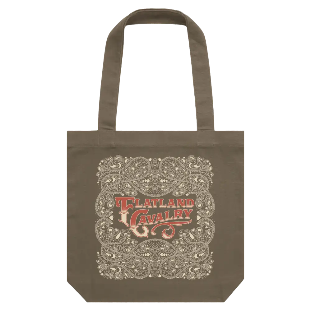 A taupe canvas tote bag featuring an intricate paisley design with the ’flatland cavalry’ logo in red and cream.