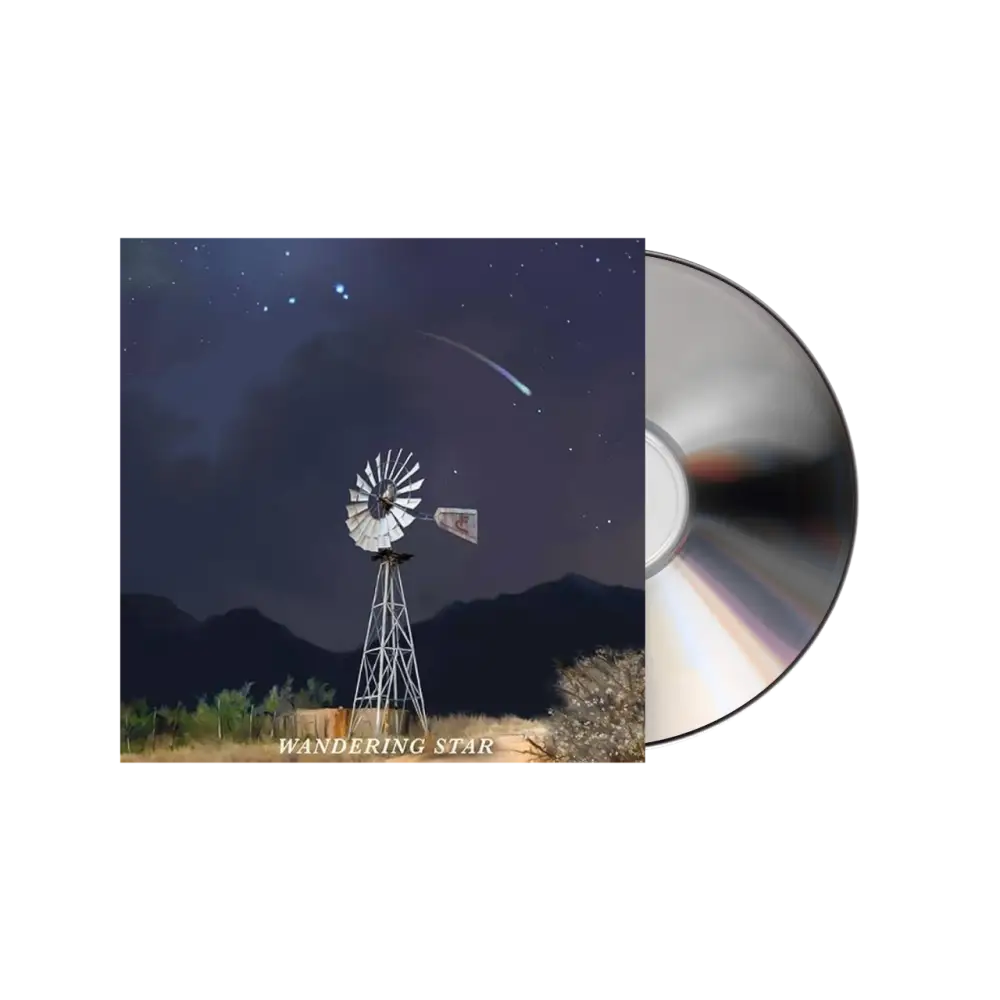 CD album cover featuring a windmill under a starry night sky with a comet.